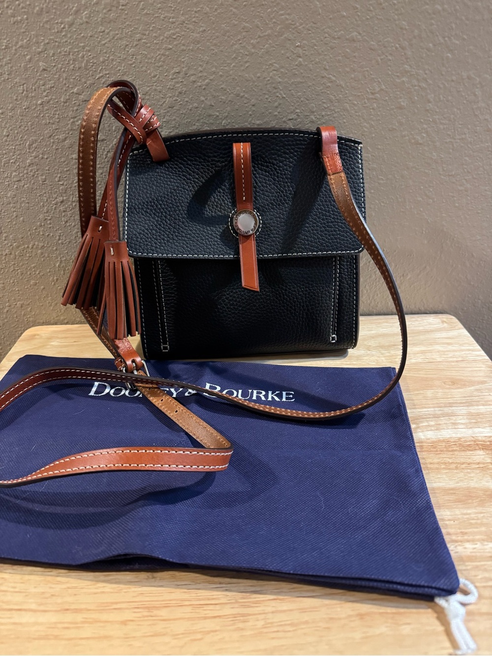 Dooney & Bourke Black Pebbled Leather Crossbody with Brown Trim and Tassel